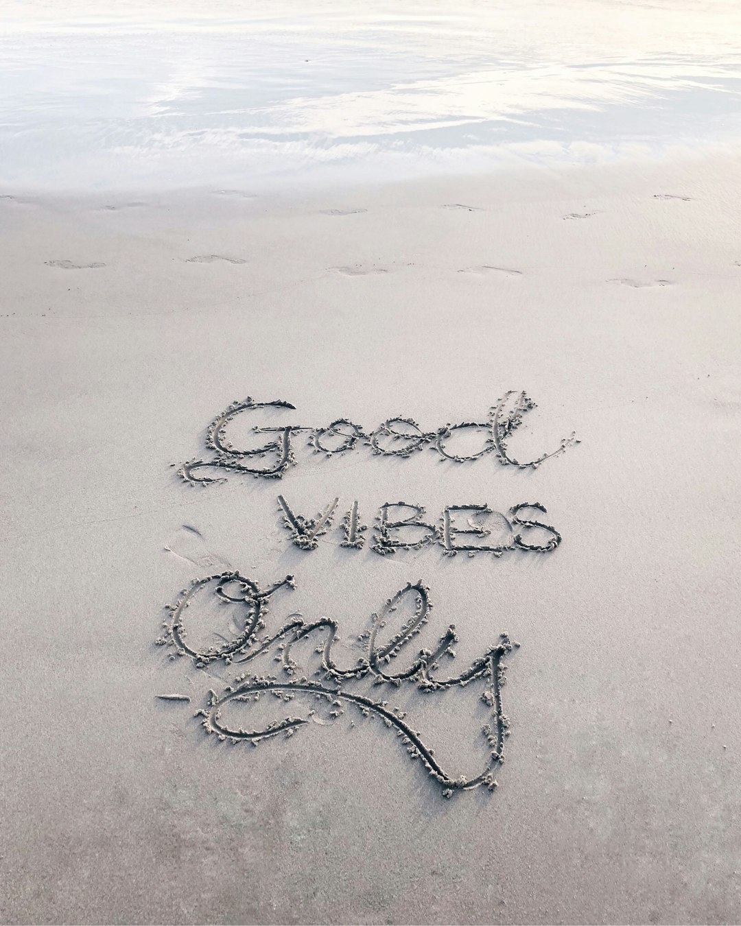 I have always loved calligraphy and if I see a spot to add some letters somewhere, I’ll usually do it. :) This was at Venice Beach, and the sand was so smooth, I had to add some words.